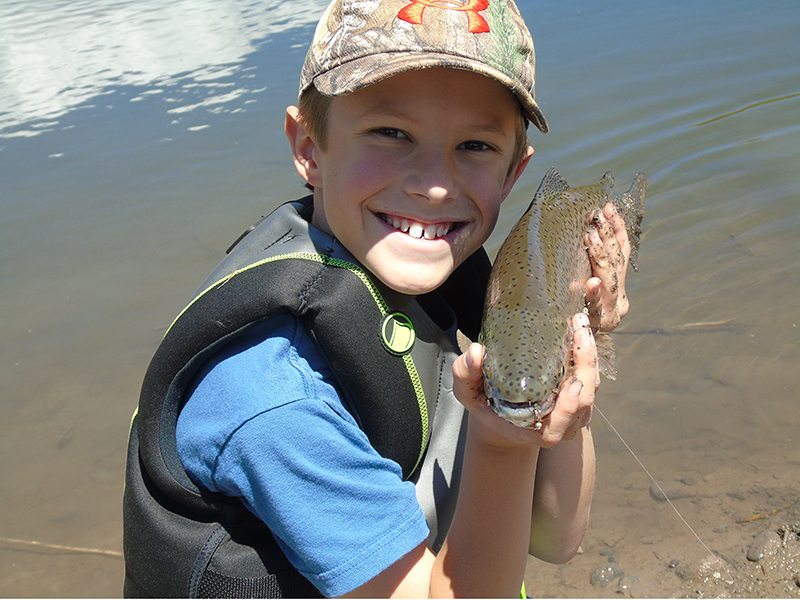 Kid holding a fish