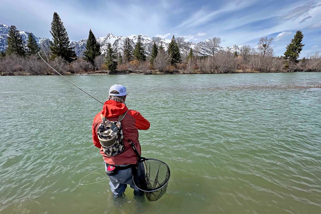 a man fishing in a Wyoming lake