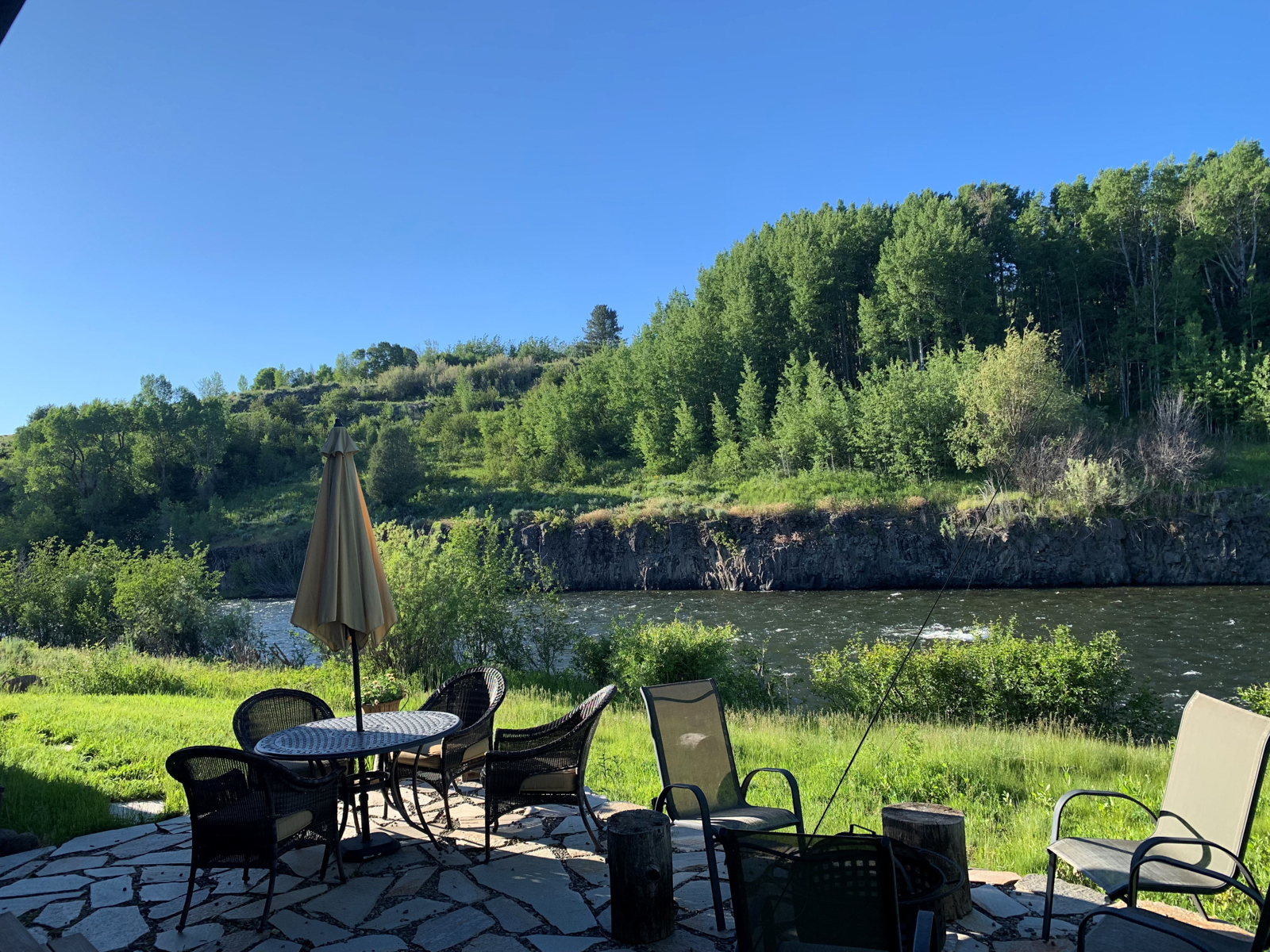 deck furniture next to the river