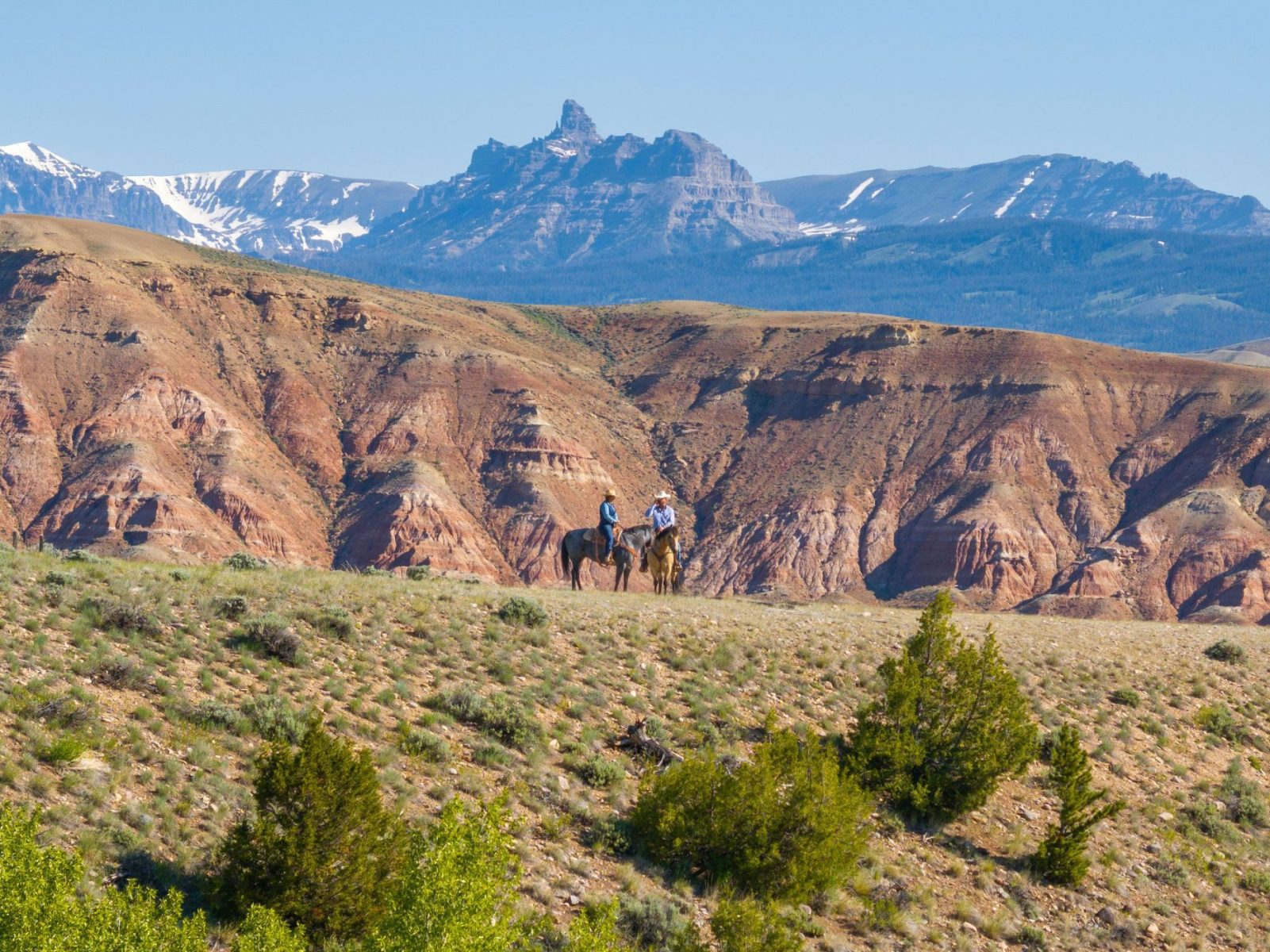 two horseback riders on ranch in Colorado for sale
