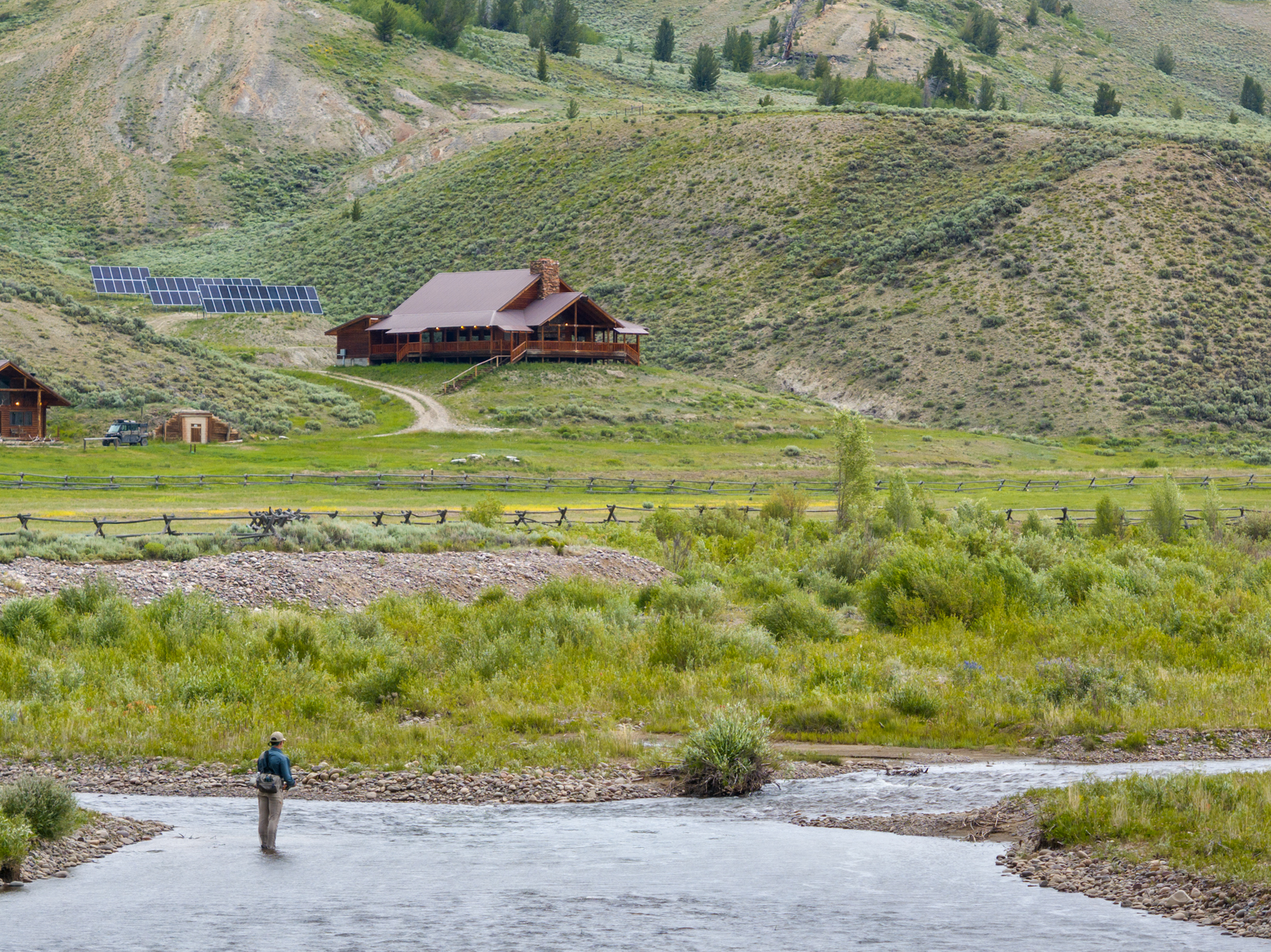 fisherman with house in the background